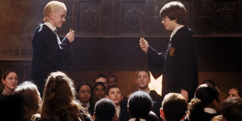 Гарри Поттер и Драко Малфой дуэль кадр из фильма.jpg
